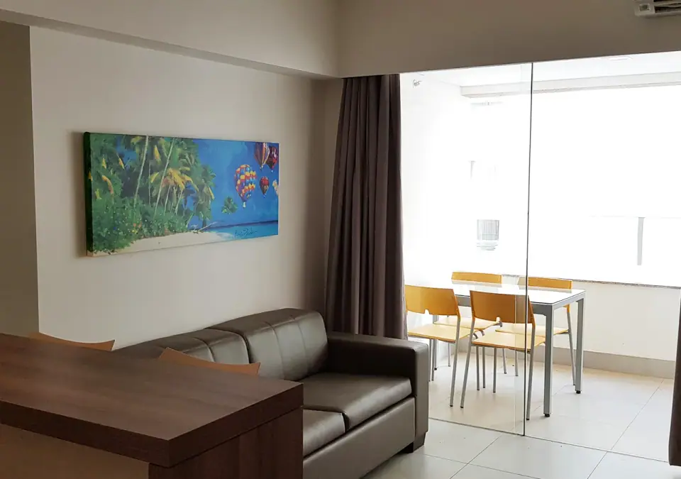 Sala integrada à varanda em suíte do Enjoy Olímpia Park Resort